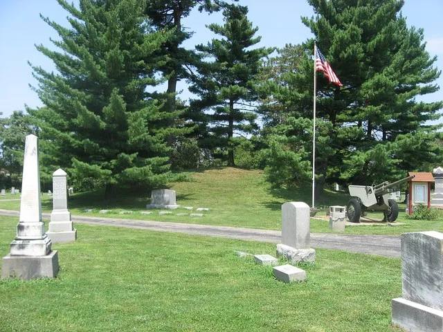 Southern side of the Odd Fellows' Cemetery Mound , located in Flagstone Cemetery (formerly the Odd Fellows' Cemetery) off Round Bottom Road in Newtown , Ohio , United States . Bui...