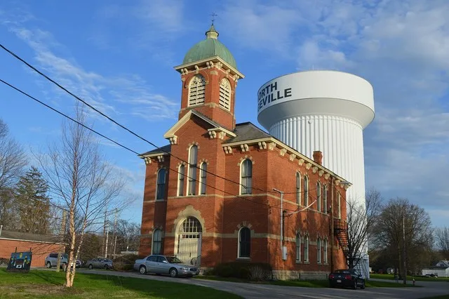 Front and western side of the North Ridgeville City Hall , located at 36119 Center Ridge Road ( U.S. Route 20 ) in North Ridgeville , Ohio , United States . Built in 1882, it is l...