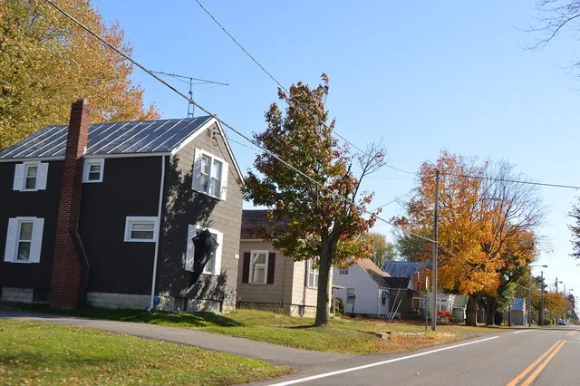Houses on the eastern side of Main Street ( State Route 602 ) south of the Caskey Street intersection in North Robinson , Ohio , United States .