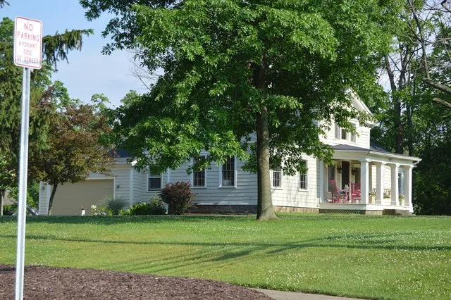 Front and northern side of the John M. Annis House , located at 9271 State Road ( State Route 94 ) in North Royalton , Ohio , United States . Built in 1833, it is listed on the Na...