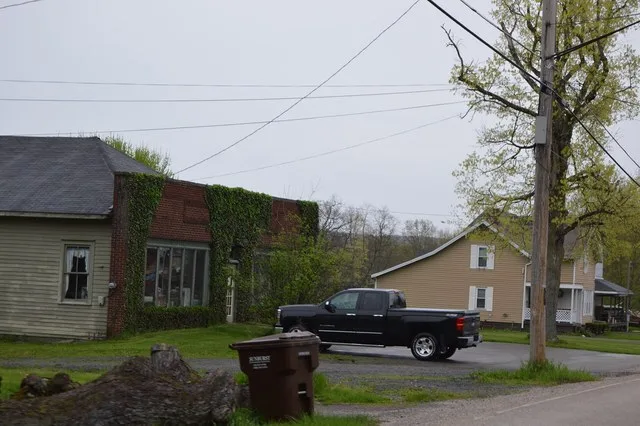 A commercial building and house on the northern side of State Route 609 in Orangeville , Ohio , United States .
