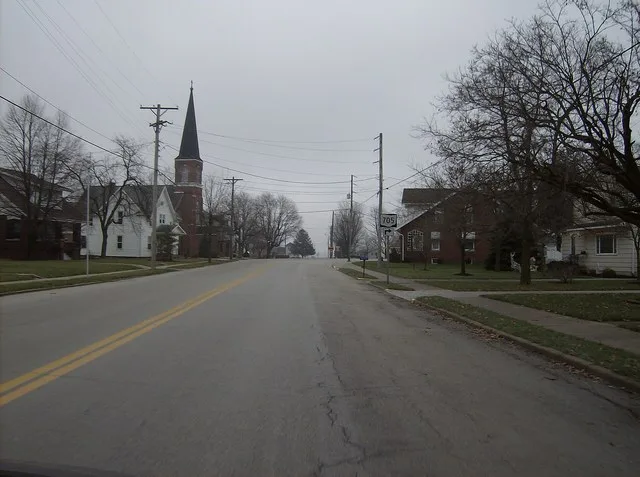 Eastward along Main Street ( State Route 705 ) in central Osgood , a village in northeastern Darke County , Ohio , United States . Note St. Nicholas Catholic Church on the left ed...