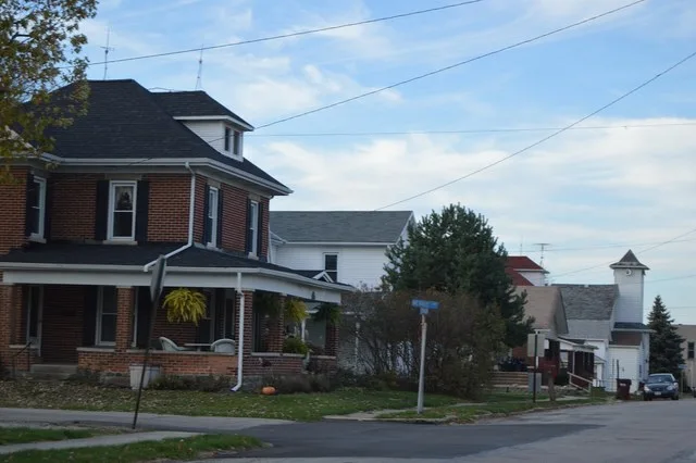 Looking north from the intersection of Jefferson Street (the community's main thoroughfare) and Merrie Lane in Pitsburg , Ohio , United States .