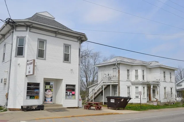 A grocery store and house on N. Main Street ( State Route 89 ), just north of Congress Street, in central Polk , Ohio , United States .