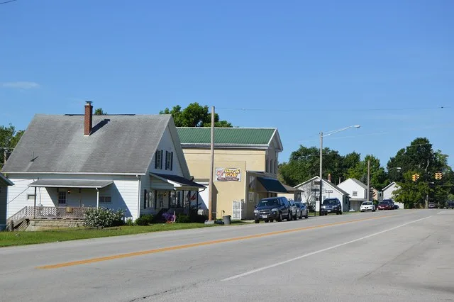 Buildings on the southern side of Main Street ( State Route 47 ) just east of the Elm Street intersection in Port Jefferson , Ohio , United States . Note the exceptional Greek Rev...