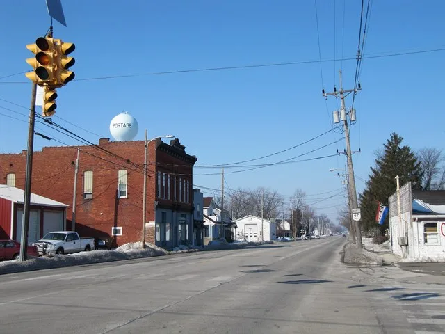 Photograph of the village of Portage , Ohio en , taken at street level from the intersection of Main Street and South Dixie Highway, looking North up Ohio State Route 25 .