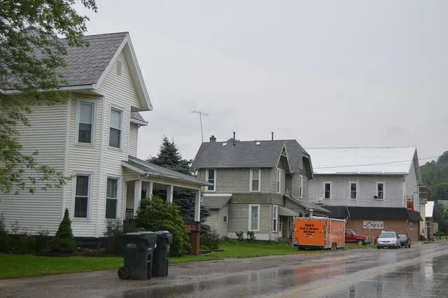 Houses on the western side of S. South Street ( State Route 265 ) south of Fair Street in Quaker City , Ohio , United States .