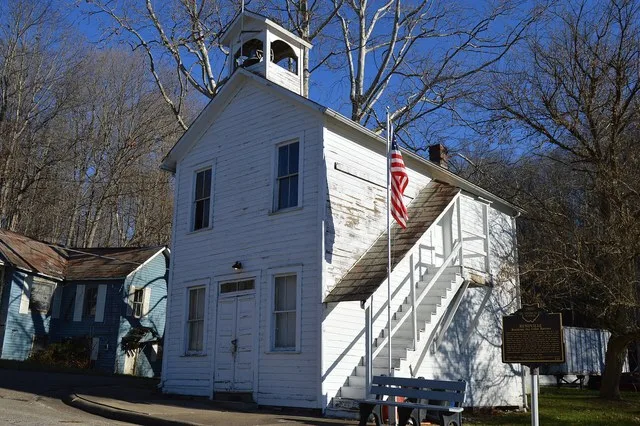 Front and southern side of Village Hall in Rendville , Ohio , United States , located on Main Street just south of Valley Street. Note the historical marker at left, which commemo...