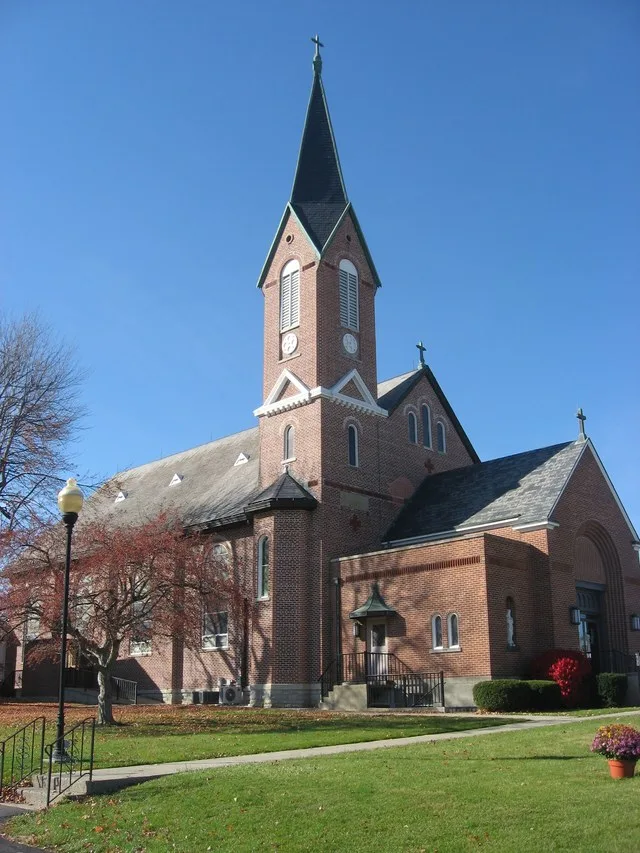Eastern side of St. Remy Catholic Church , located on E. Main Street in Russia , Ohio , United States . Built in 1890, the church was added to the National Register of Historic Pl...