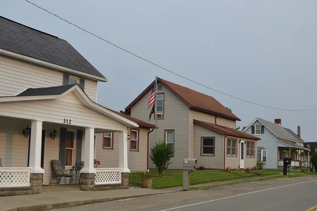 Houses on the eastern side of the 300 block of N. High Street ( State Route 285 ) in Senecaville , Ohio , United States .