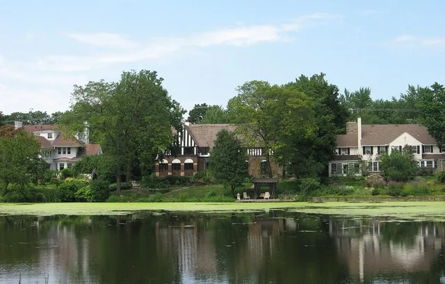 A picture of 3 houses across from green lake in Shaker Heights, Ohio , USA.