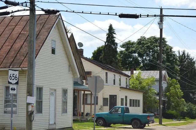 Houses on the southeastern side of Main Street ( State Route 656 ) southwest of the Church Street intersection in Sparta , Ohio , United States .