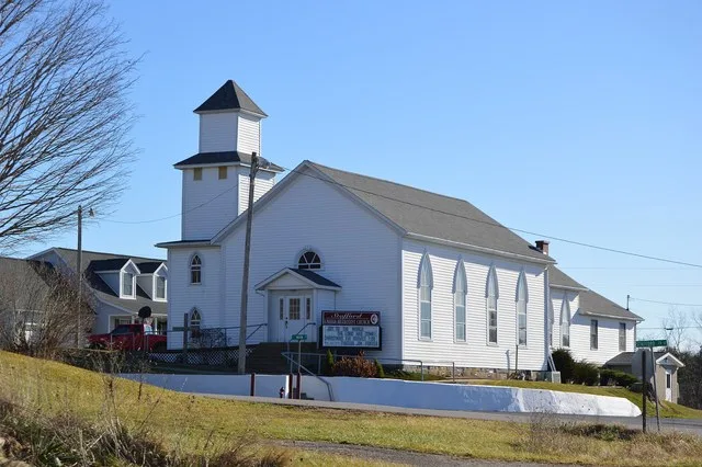 Front and western side of Stafford United Methodist Church, located at the intersection of State Route 145 and Main Street in Stafford , Ohio , United States .