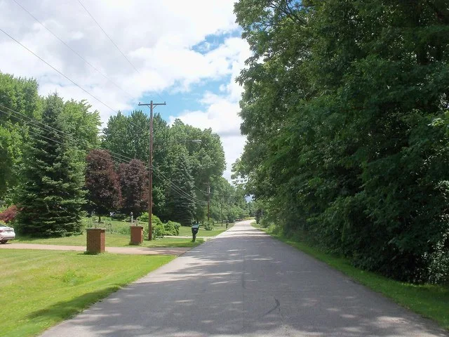 A view to the east on Lake Martin Drive in Sugar Bush Knolls, Ohio shows the wooded character of the community.