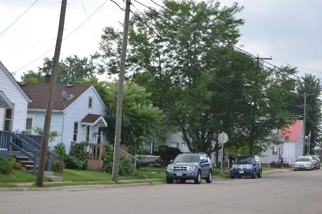 Houses on the eastern side of High Street, seen looking southeast from the Maple Street intersection, in Thurston , Ohio , United States .