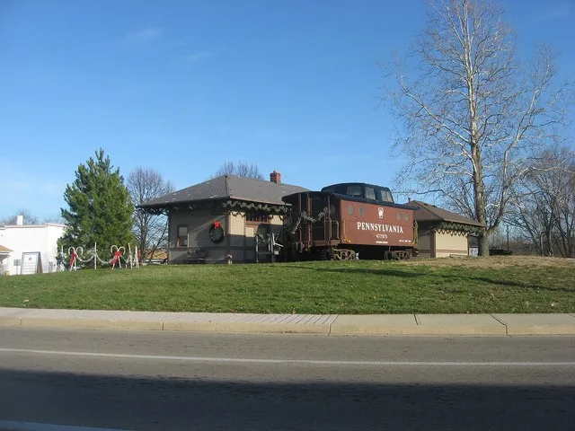 View from the west of the Trotwood Railroad Station , located at 2 E. Main Street in Trotwood , Ohio , United States . Built in 1913, it is listed on the National Register of Hist...