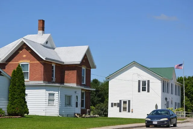 A house and the village hall, located on Main Street northwest of Sycamore Street in West Leipsic , Ohio , United States .