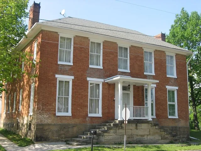 Front and western side of the Joseph Ijams House , located at 7660 Main Street in West Rushville , Ohio , United States . Built in 1810, it is listed on the National Register of H...