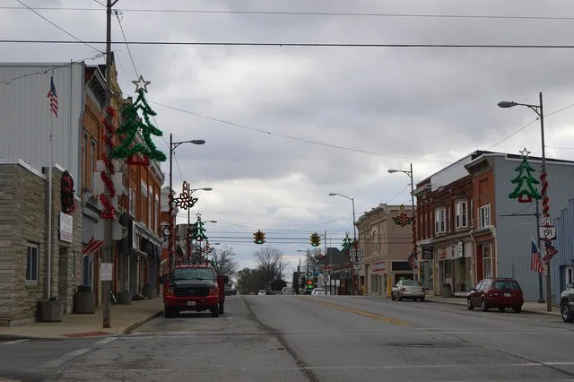 Looking eastward on Jackson Street (U.S. Routes 20 Alternate / 127 ) from the High Street intersection in central West Unity , Ohio , United States .