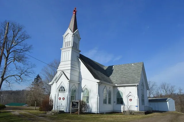 Front and northeastern side of the Wilkesville Presbyterian Church, located at 107 S. High Street in Wilkesville , Ohio , United States . It was constructed after an 1885 fire des...