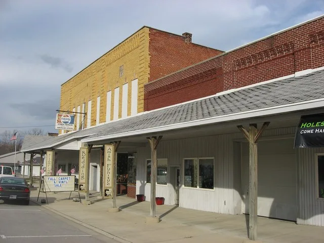 Buildings on the eastern side of State Street ( U.S. Route 33 / State Route 49 ) between Simpson and Walcott Streets in downtown Willshire , Ohio , United States .