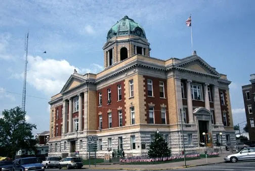 Monroe County Courthouse , located along Main Street in Woodsfield , Ohio , United States . Designed by Samuel Hannaford and built in 1905, it is listed on the National Register o...
