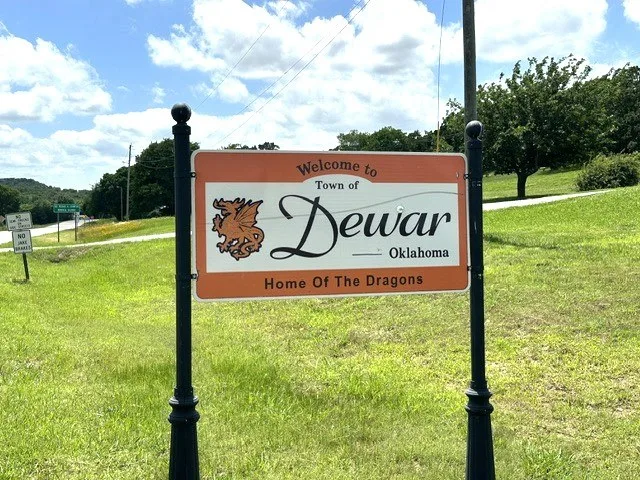 Welcome sign in Dewar, June 2026