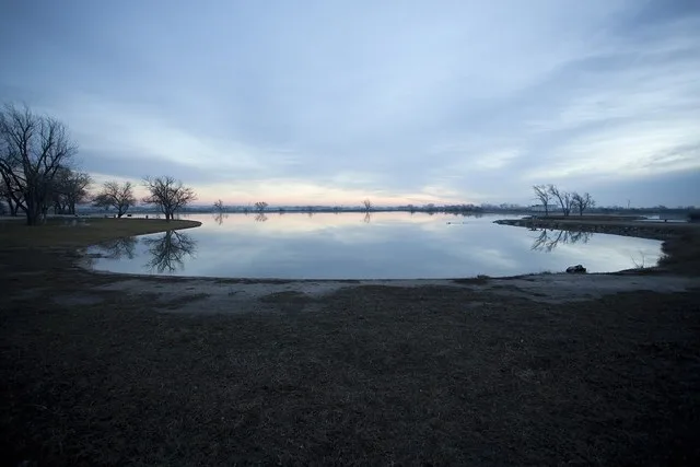 A clear, spring-fed lake at Artesian Beach Park in Gage, Oklahoma .