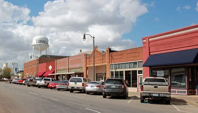 The New Cordell Courthouse Square Historic District, in New Cordell, Oklahoma. The view is looking west on East Main Street, on the north side of the county courthouse.