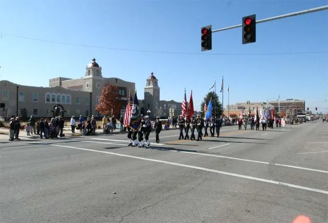 Veteran's Day parade down Grand Avenue in Ponca City in front of the Civic Center and town square taken by the contributor and put into Public Domain.