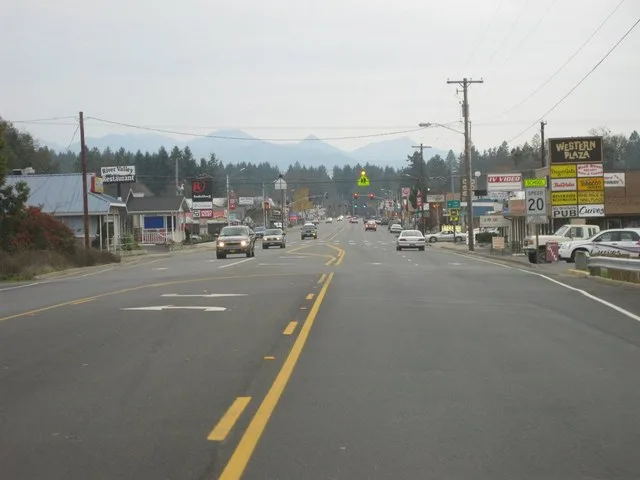 Cave Junction, Oregon. Driving into town from the North. The mountains in the background starting from the right are Wounded Knee, Broken Rib, Haystack, Little Sanger Peak, Big Sa...