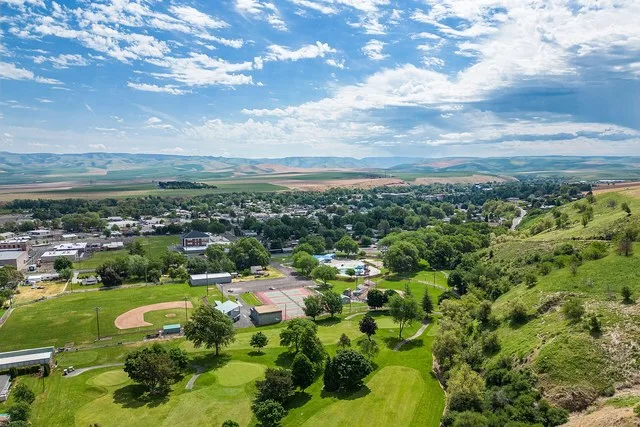 Aerial photograph over Milton-Freewater Golf Course looking southeast over the city