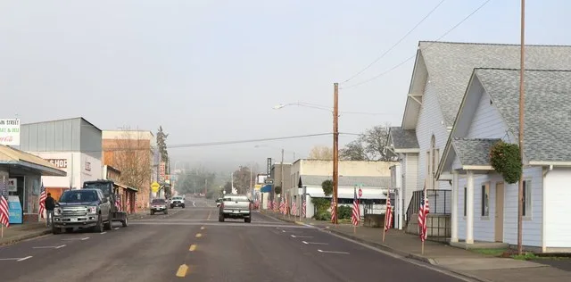 A picture of Main Street featuring the local church in the foreground.
