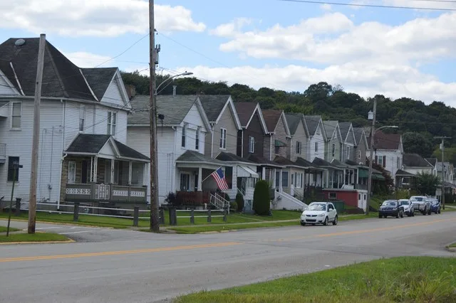 Houses on Westmoreland Avenue ( Pennsylvania Route 156 ) west of Third Street in Avonmore , Pennsylvania , United States .
