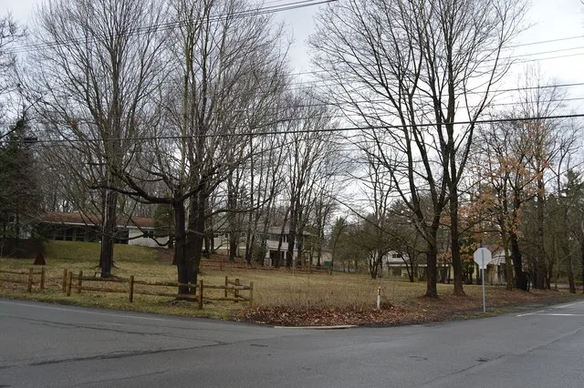 Typical wooded-residential scene in Bradford Woods , Pennsylvania , United States , seen looking northwest from the junction of Bradford and Wexford Run Roads.