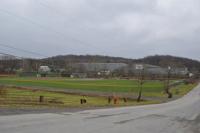 A ballfield and factory in Callery , Pennsylvania , United States . Picture looks west-southwest along Center Street.