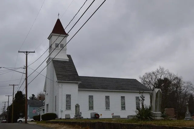 Eastern side and front of St. Paul's United Church of Christ, located on Constitution Avenue in Connoquenessing , Pennsylvania , United States .