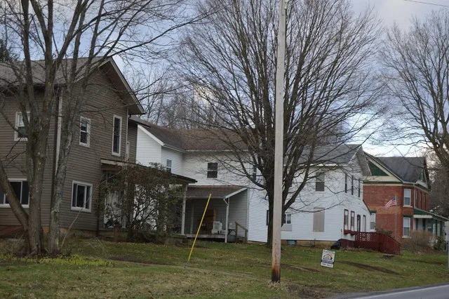 Houses on the southern side of Main Street ( U.S. Route 322 ) east of the Church Street intersection in Corsica , Pennsylvania , United States .