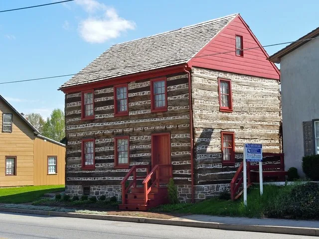 Log cabin in East Berlin, Pennsylvania (no typo), with stone placed between the logs. Workman on site said he heard it was built 1770 FWIW. Part of the East Berlin Historic Distri...