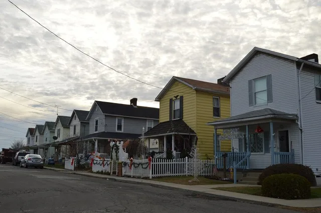 Houses on the western side of Foster Avenue south of the Fourth Street intersection in East Rochester , Pennsylvania , United States .