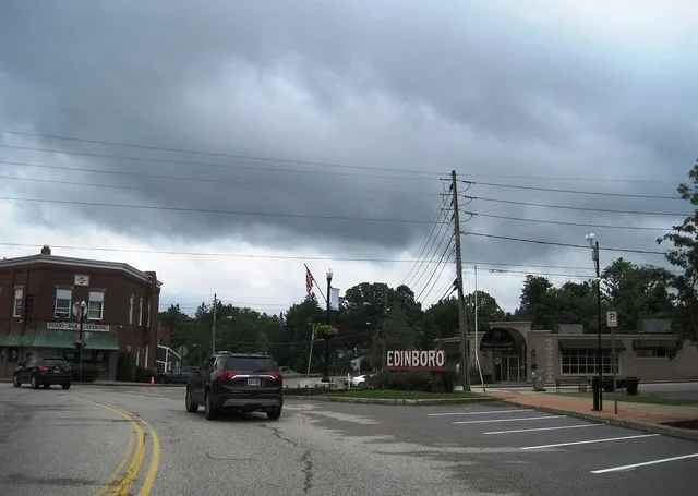 Photo of southbound Pennsylvania Route 99 (Erie Street) in Edinboro , Pennsylvania . Photo taken looking south-southwest between U.S. Route 6N (Plum Street) and Short Street / Wat...