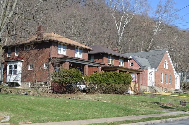 Houses and Grace Orthodox Presbyterian Church on the northern side of the 1400 block of Beaver Street in Glen Osborne , Pennsylvania , United States .