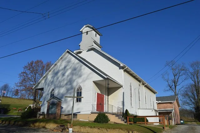 Front and southern side of the Hookstown Free Methodist Church, located at 255 Main Street in Hookstown , Pennsylvania , United States .