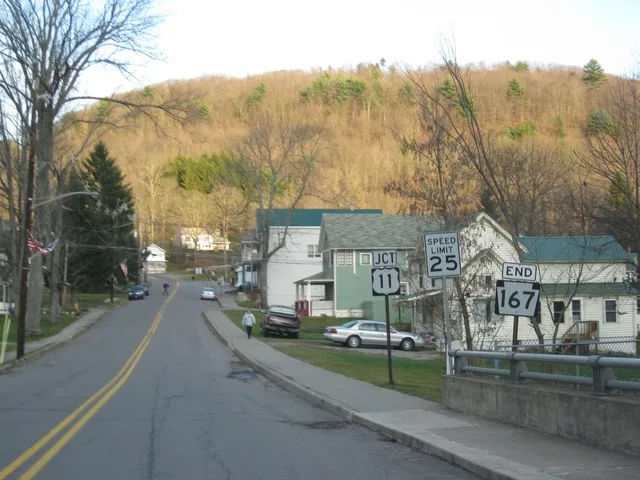 Pennsylvania State Route 167 approaching its southern terminus with U.S. Route 11 in Hop Bottom, Pennsylvania.