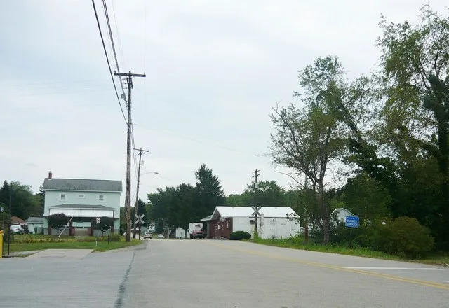 Looking toward the southeast on Bridge Street, just outside the borough boundary. (Note boundary sign at right.) Borough of Hunker, Westmoreland County, Pennsylvania.