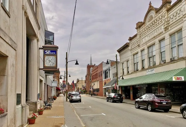 A view southward along Main Street in downtown Irwin, Pennsylvania, as seen from in front of the Irwin Savings & Trust Company building just past the corner of Third Street.