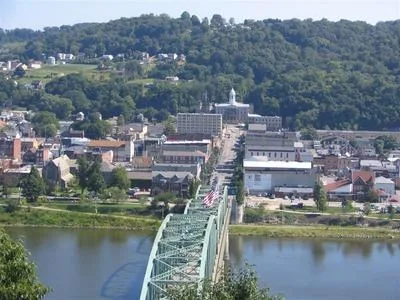 A picture of Kittanning taken from atop a large hill which is also a park. The court house can be seen as one of the most noticeable features.