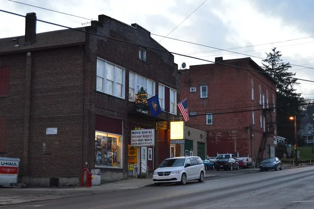 Buildings on the southern side of E. State Street ( Pennsylvania Route 208 ) east of the Main Street intersection in Knox , Pennsylvania , United States .