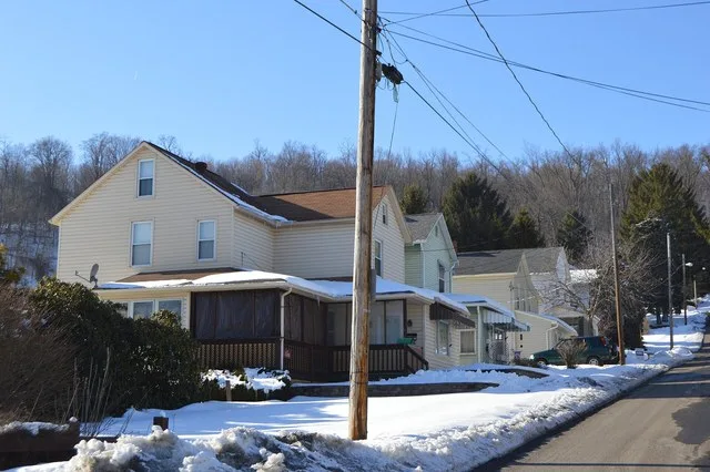 Houses on the western side of Blue Diamond Street north of the Thelma Avenue intersection in Lorain , Pennsylvania , United States .
