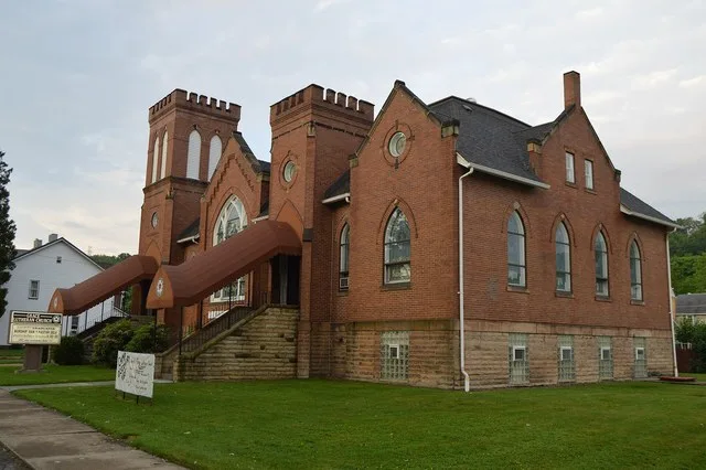 Front and southern side of Grace Lutheran Church, located at the junction of Water and Manor Streets in Manorville , Pennsylvania , United States .